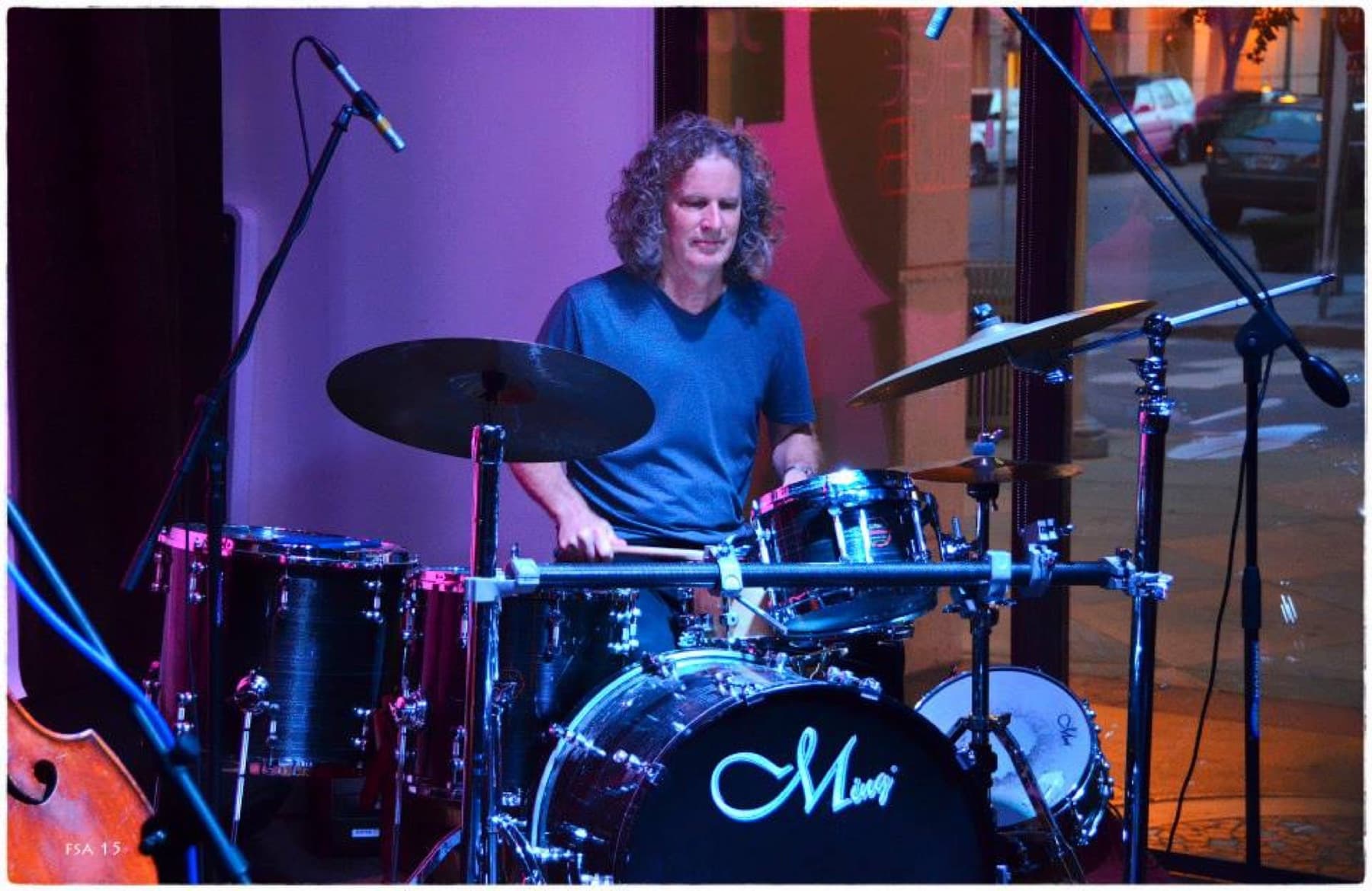 Steve Rucker behind a full drum kit on stage