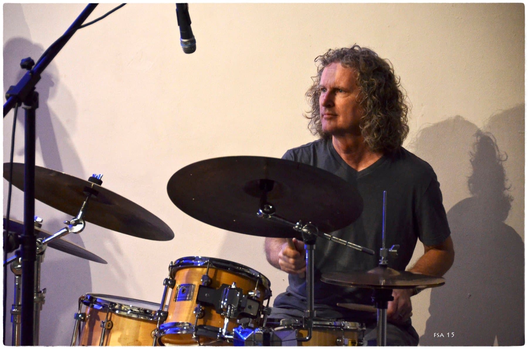Steve Rucker at the drum kit during a faculty concert at WDNA, 2015
