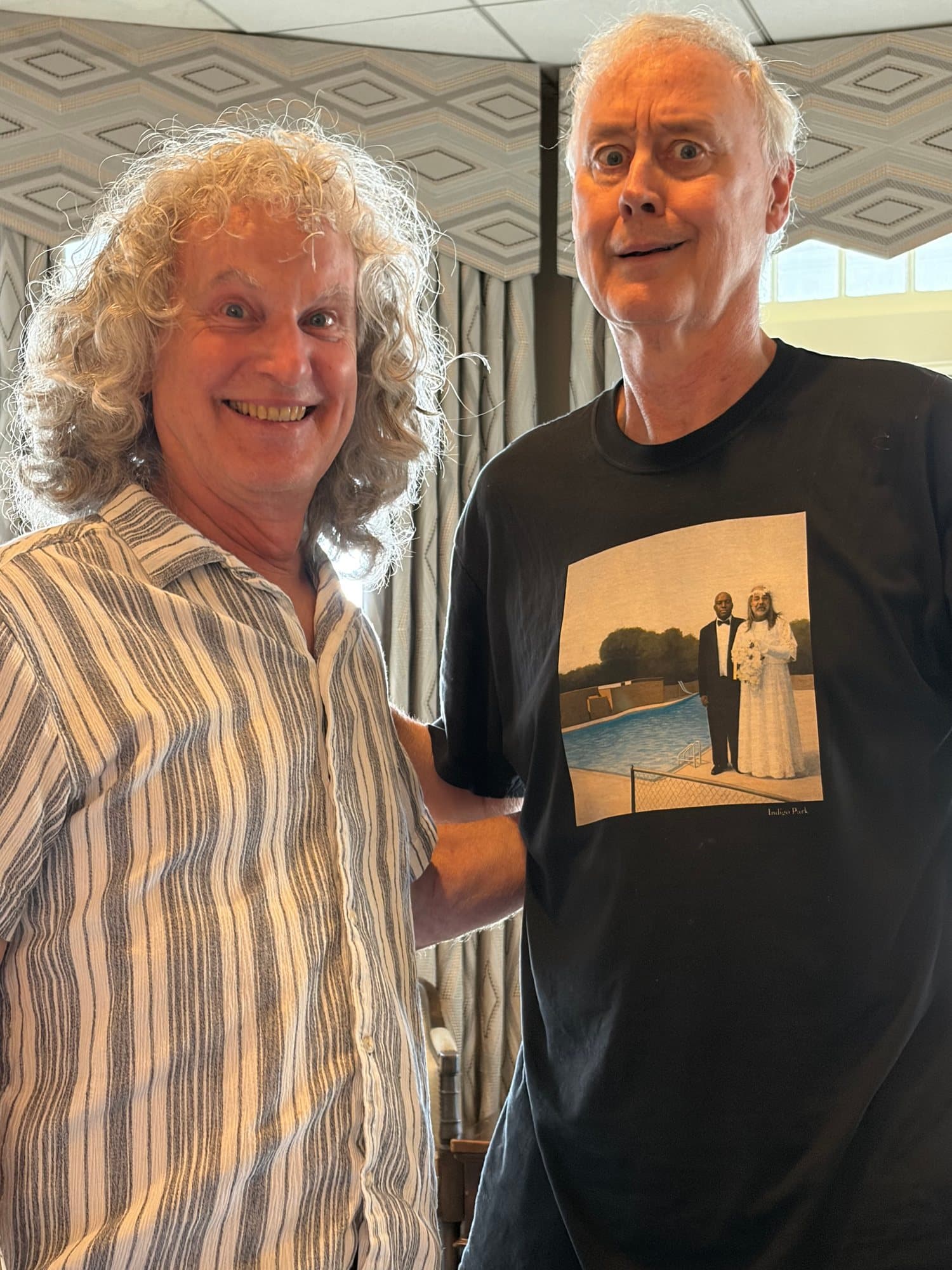 Steve Rucker smiling alongside Bruce Hornsby